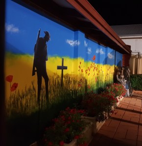 Mural at Northam RSL showing a lone digger in a field of poppies